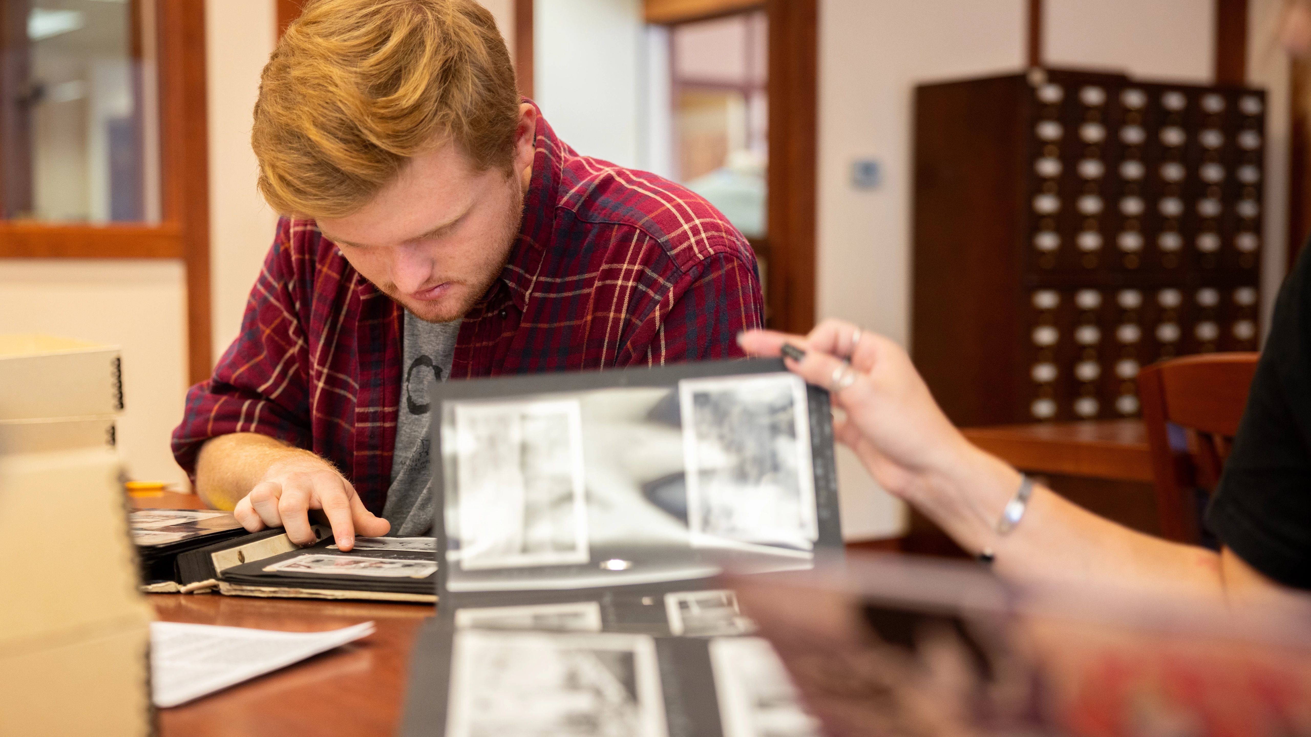 History students reviewing documents in NAU Special Collections