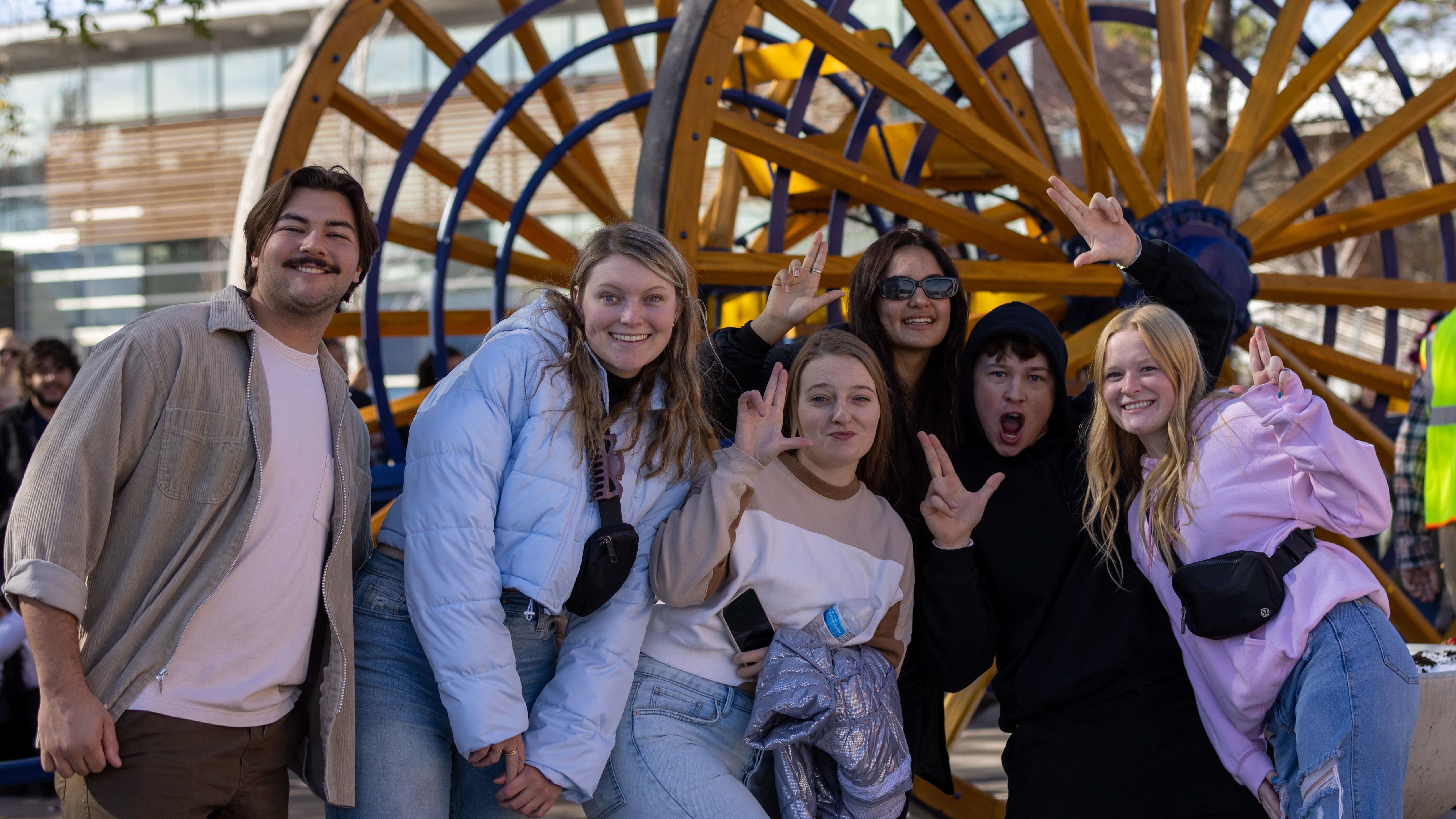 Students in front of Logging Wheels