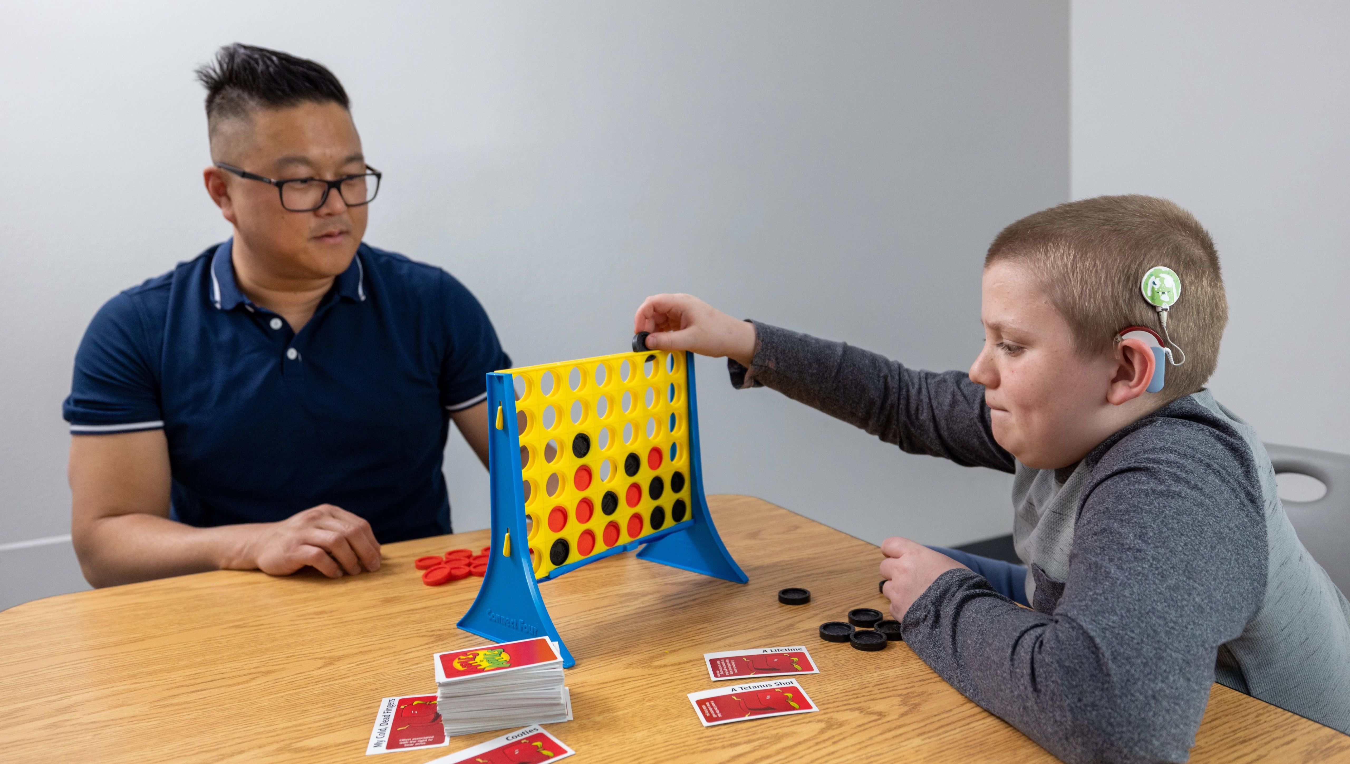 Clinician and Patient Playing Connect Four