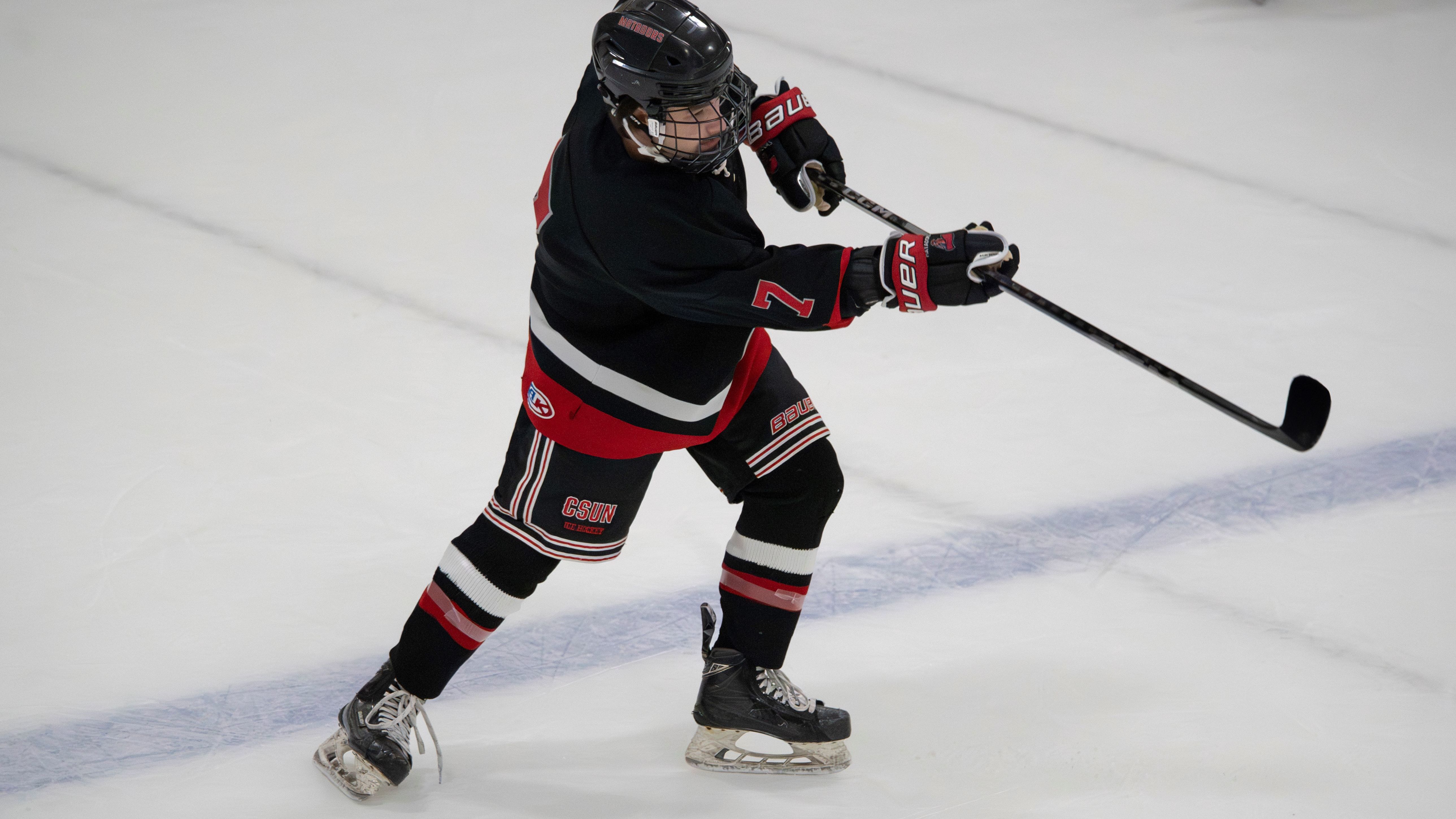Person playing ice hockey