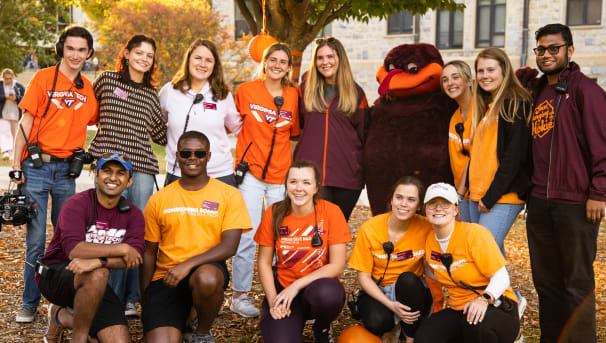 Homecoming Board members smile at Homecoming Kickoff