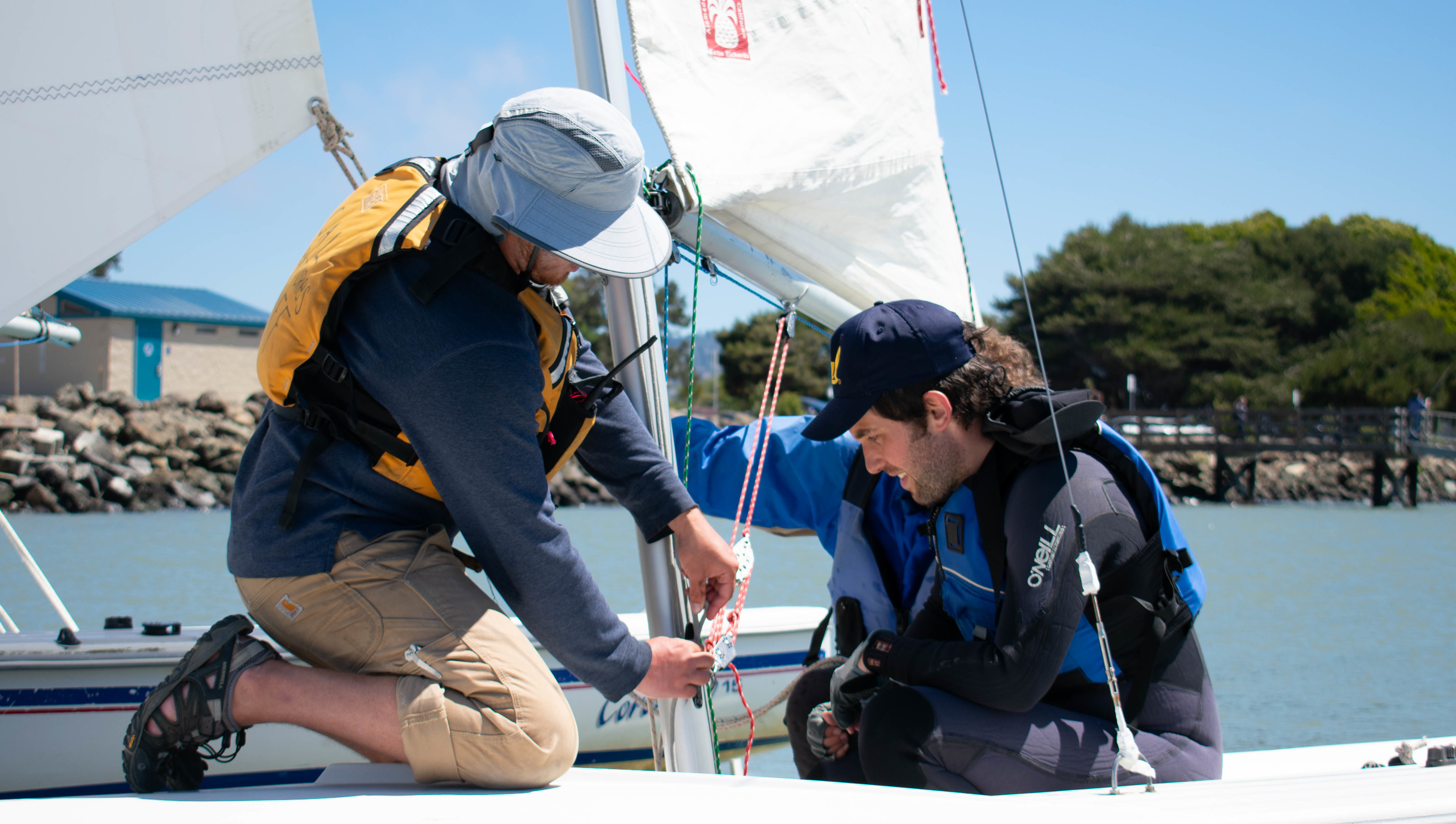 Two participants working on a boat