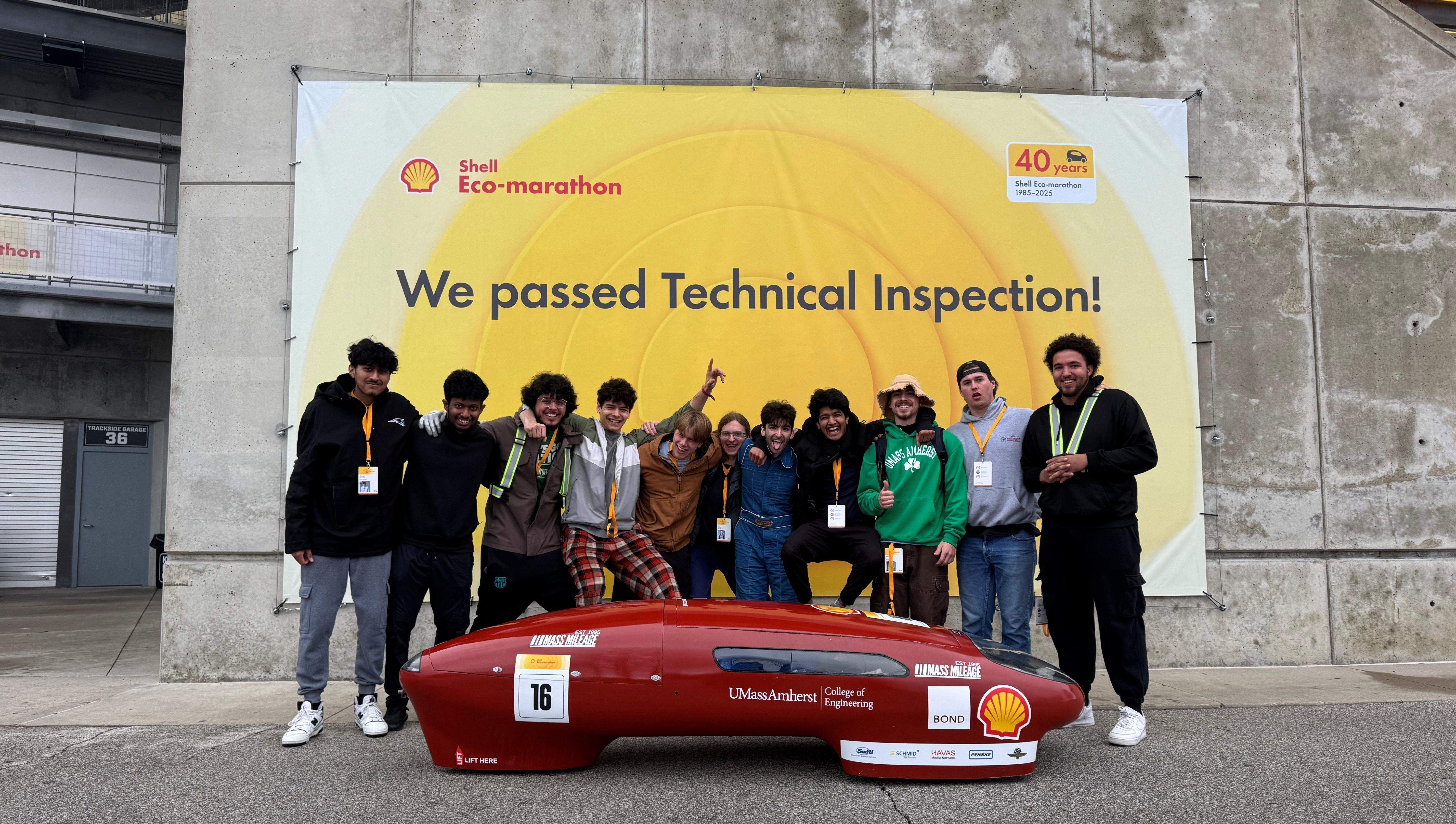 Team photo with vehicle at Eco-marathon