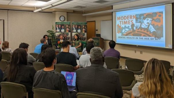 COB live event, students watching panelists.