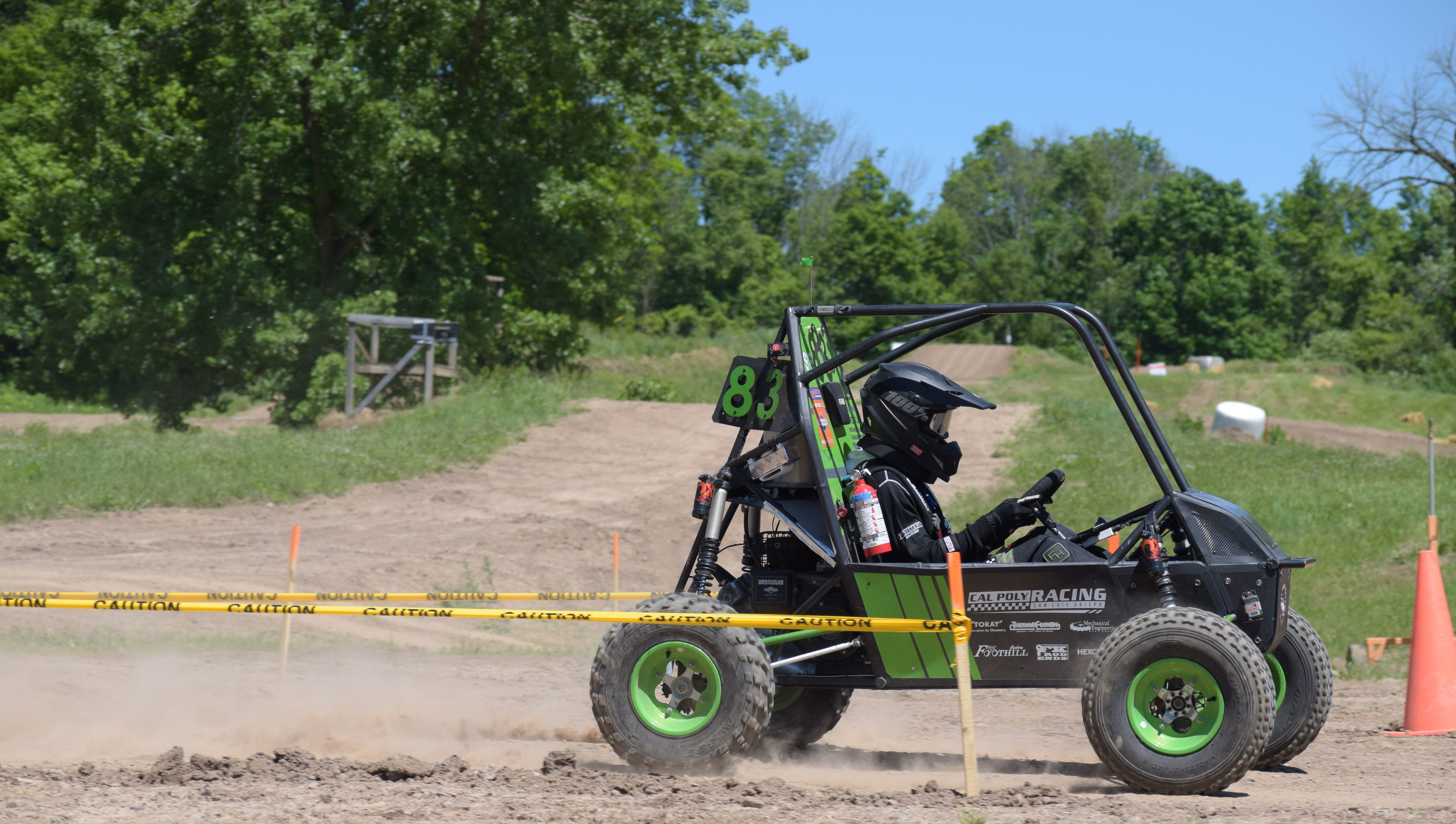 A Cal Poly Racing team member at a competition.