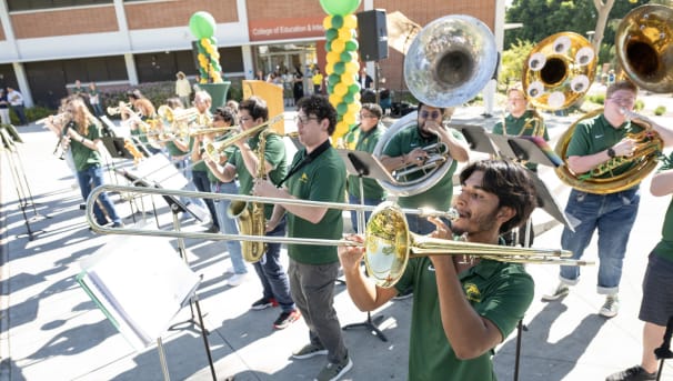 Pep Band performing together on the Quad of CPP