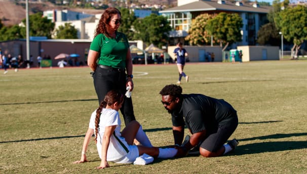 Athletic Trainers helping cross country athlete