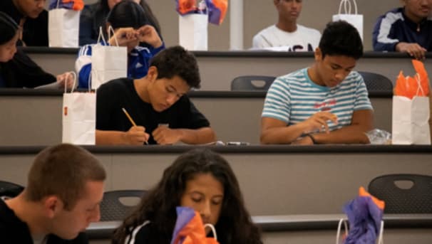 Students sitting at desks taking tests