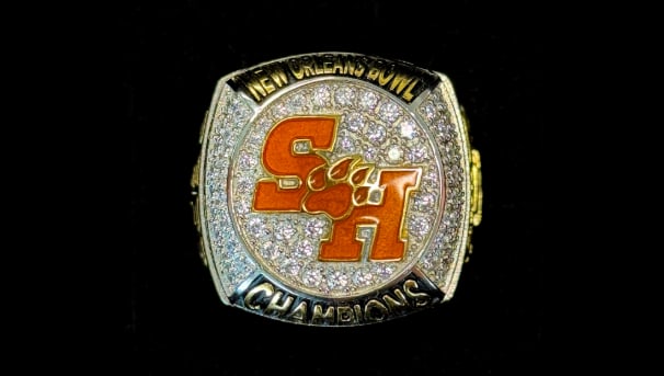 Image of New Orleans bowl ring on a black background