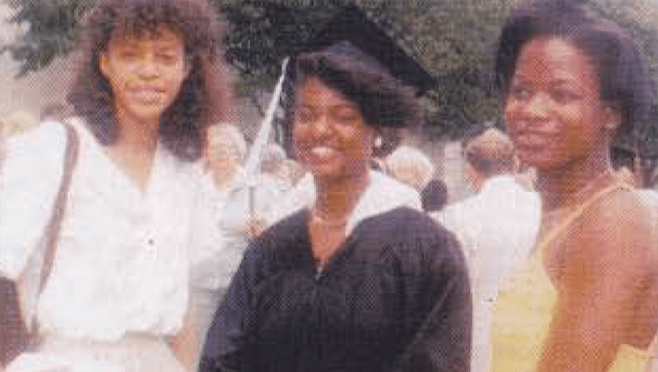 Sandra Y. Alexander and two other women stand together at her graduation