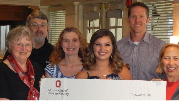 The 2016 recipient holds the Delaware County scholarship. Around her is her family members