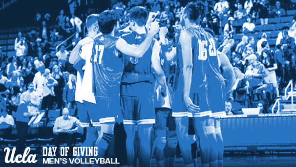the men's volleyball team huddles on the court