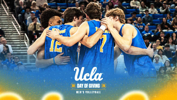 UCLA Men's Volleyball team in a huddle on the court.
