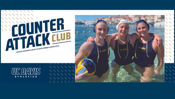 Three women's water polo student-athletes standing in water with arms around each other