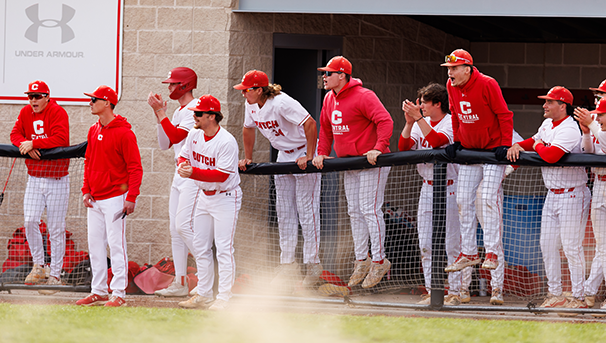 Central Baseball team celebrating in the dugout.