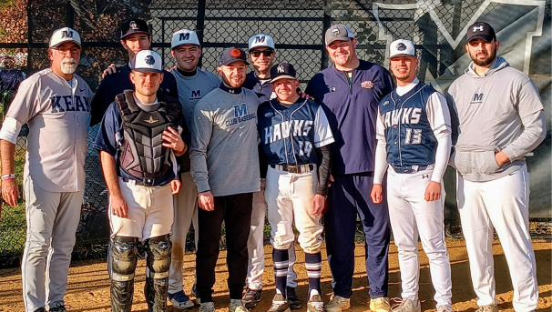 group of players posing for a photo wearing baseball gear