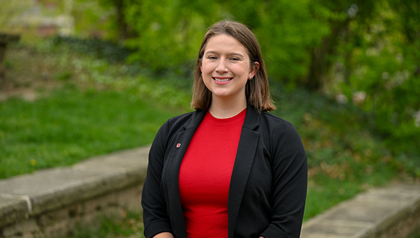 Individual standing outside smiling