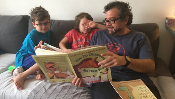 Carlos reading to kids