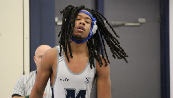 Male wrestler in after completing a match