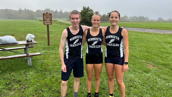 Three members posing for a photo in MU gear after a run