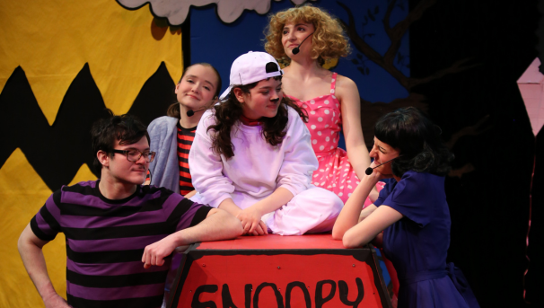 Costumed performers on stage during a showing of You're a Good Man, Charlie Brown
