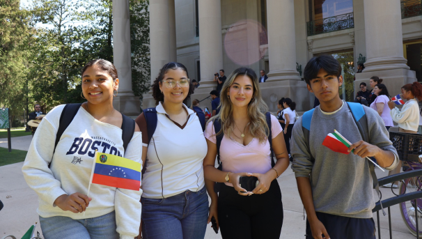 LASO members holding flags at a campus event in front of the Great Hall