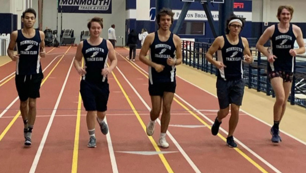 Five members of the XCTF Club running on indoor track