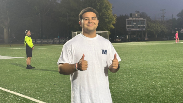 student giving thumbs up on the monmouth soccer field