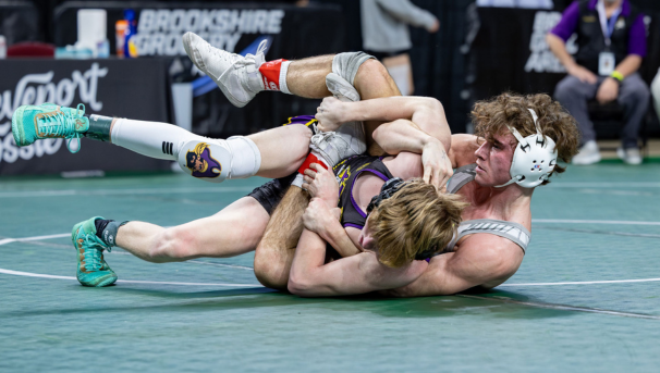 Captain John Dooley wrestling an opponent