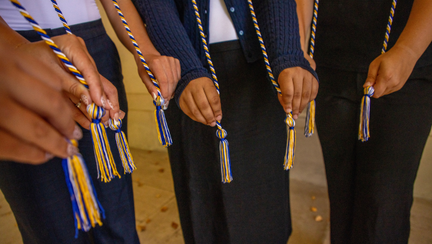 Students holding cords