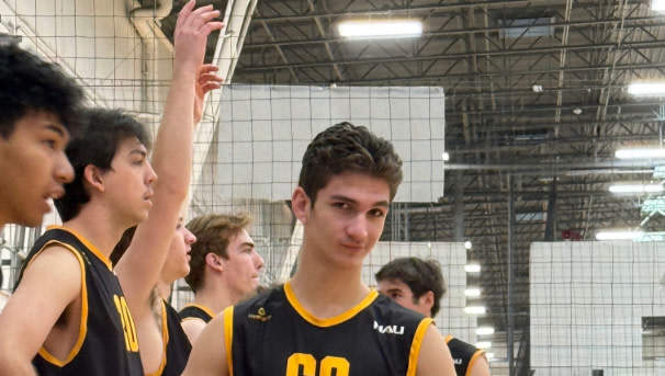 Number 69 Jackson Keeney is posing for a picture while standing on the sidelines.