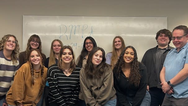 RMPA Club Members pose together in a classroom