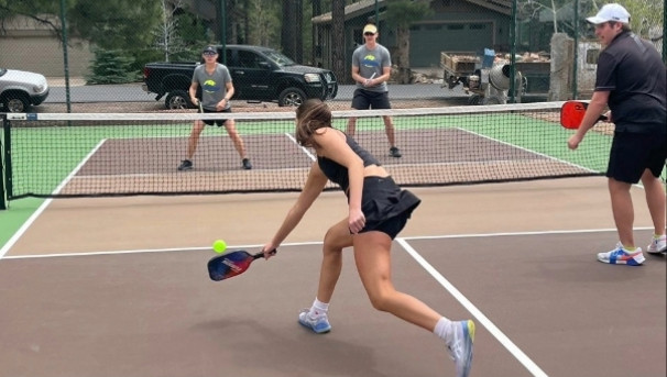 Former club player Hailey recovers a shot at one of our open play nights at Flag Ranch.