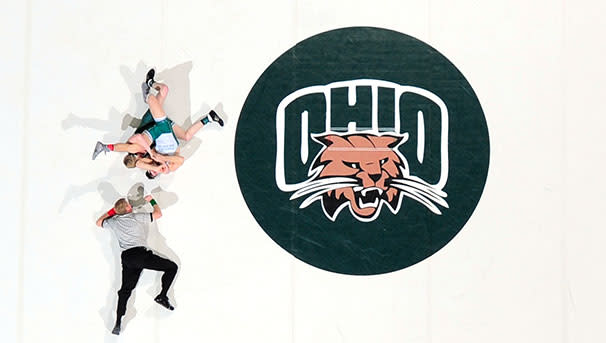 photo of wrestlers and ref on OHIO mat