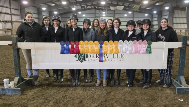 Team with their ribbons at a competition