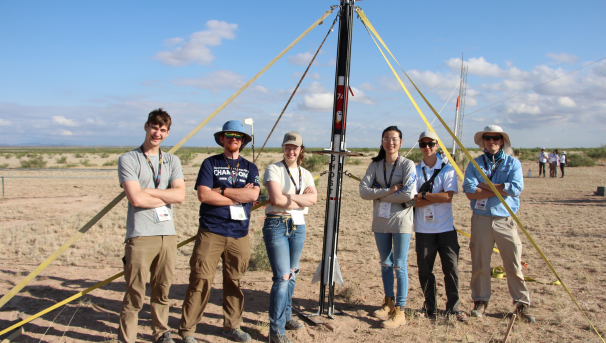 Group of students with rocket
