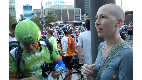 Individuals talking to each other while cheering for Pelotonia riders on August 8, 2013