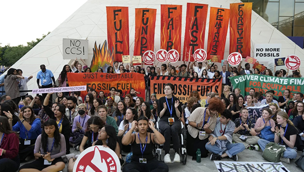 Final youth demonstration outside with people holding up signs