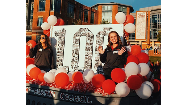 Abby standing on Student-Alumni Council float during the Homecoming parade