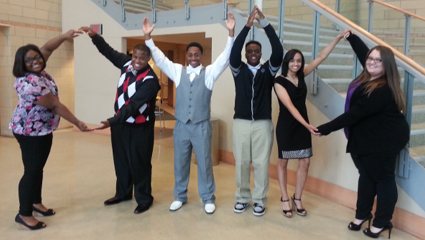 Six students from the Youngstown Class of 2012 standing in the hallway doing OHIO