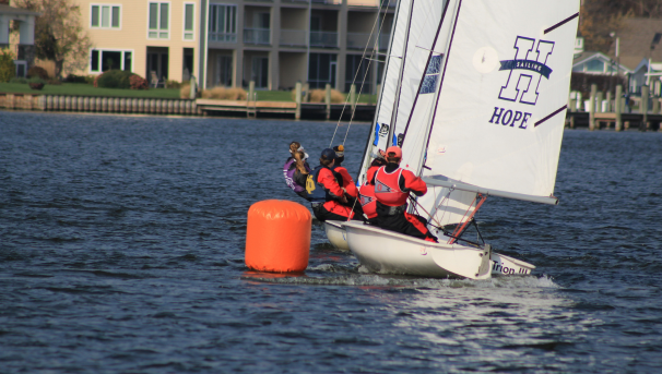 Sailors on multiple boats in the water