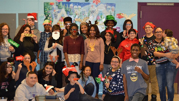 Group of students wearing Christmas themed props at a party