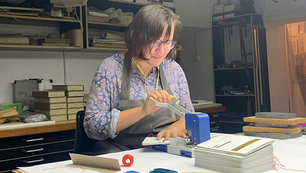 Julia Keblinska working on a project in 2022 at the Łódź book museum
