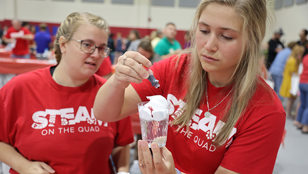 Two students working on a science experiment