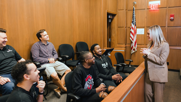 Law student speaking to other students