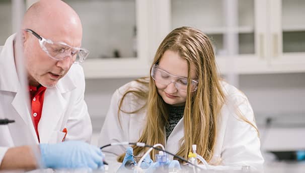 An honors student and her mentor conduct research