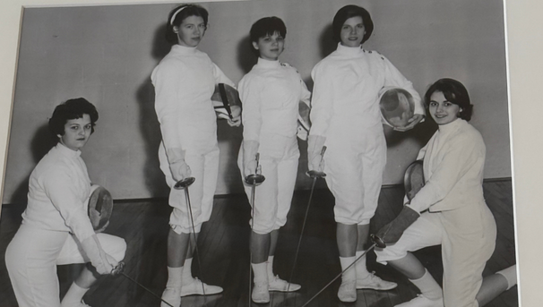 Black and white photo of 5 fencers from a long time ago