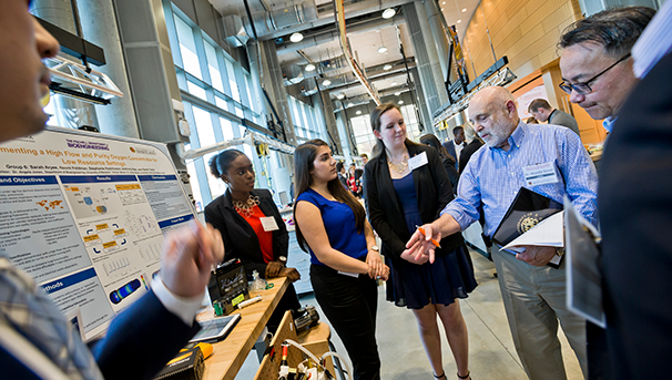 Bioengineering undergraduates meet with judges at their Senior Capstone Design competition.