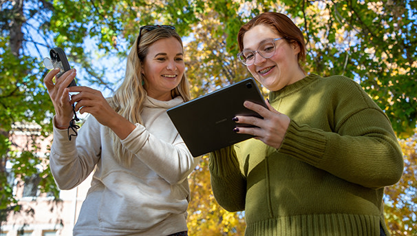 Two UM students conduct fieldwork for a geography class.