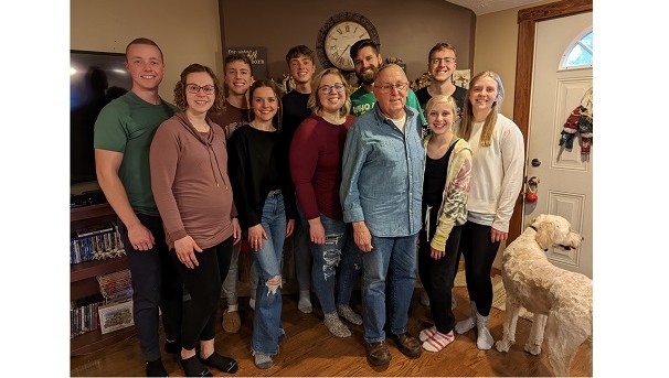 Dale Fahrenholz and his family pose in a living room for a photo